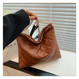 Stylish brown quilted chain shoulder bag, large capacity slouchy design for women fashion.