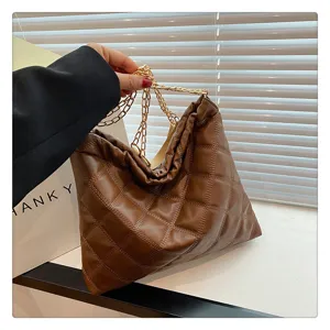 Brown quilted leather shoulder bag for women, stylish large capacity tote with gold chain strap.