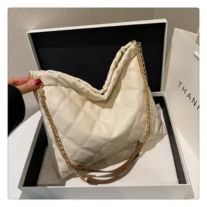 Off-white quilted shoulder bag with chic gold chain strap, soft PU leather material, spacious.