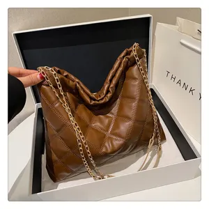 Brown quilted hobo shoulder bag detail, soft PU leather with gold chain strap, stylish daily wear.