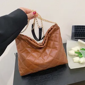 Stylish brown quilted large chain shoulder bag for women, versatile and spacious everyday tote.