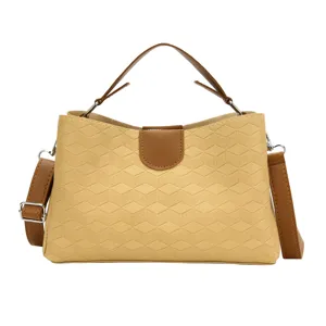 Stylish PU leather handbag with geometric pattern, top handle and shoulder strap for women.