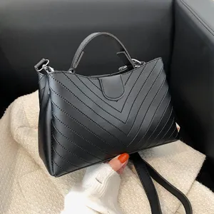 Black faux leather underarm shoulder bag for women, chic casual crossbody bag with chevron pattern.