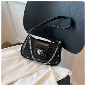 Black crocodile pattern baguette shoulder bag with silver heart clasp and chain strap for women.