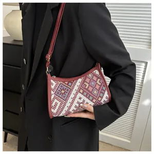 Ethnic style woven crescent shoulder bag, trendy autumn fashion crossbody handbag for women.