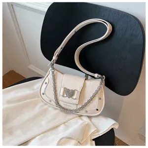 Chic white crocodile pattern shoulder bag with chain and heart buckle for stylish women.