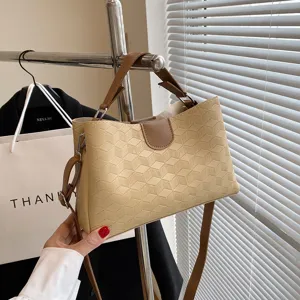 Elegantly designed PU leather handbag for women, large capacity geometric shoulder bag.