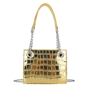 Glossy gold metallic crocodile texture shoulder bag with silver chain and top handle for women.