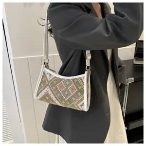 Ethnic style woven shoulder underarm bag for women, stylish autumn fashion crescent handbag.