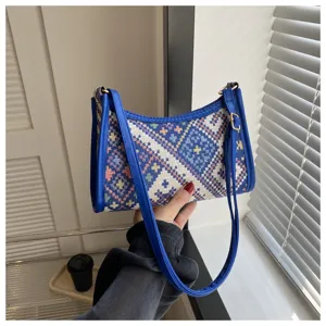 Ethnic woven underarm shoulder bag for women, stylish crossbody moon bag with blue PU trim.