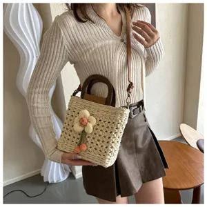 Stylish woven straw bucket bag with wooden handle, trendy casual handbag for women.