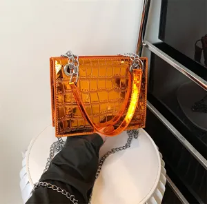 Glossy orange chain crossbody bag, metallic crocodile pattern small square handbag for women.