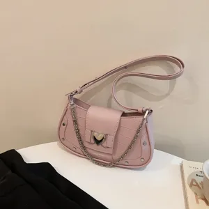 Chic pink crocodile pattern baguette shoulder bag with metallic chain and heart buckle.