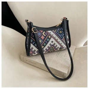 Ethnic woven shoulder bag with black PU leather trim, stylish hobo moon bag for women.