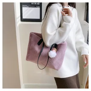 Chic faux fur plush tote bag for women winter fluffy shoulder bag with cute pompom charm.