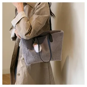 Detailed view of fluffy plush shoulder bag, cozy lamb wool tote for women autumn winter style.
