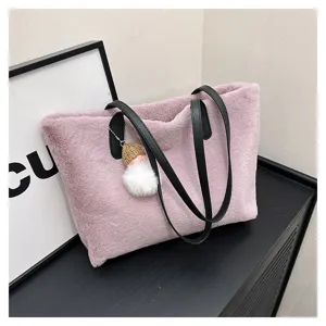 Pink plush shoulder bag, soft faux fur tote with black handles and cute knit doll pendant.