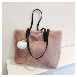 Plush shoulder bag detail, pink faux fur tote bag with black leather straps and cute charm.