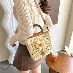 Stylish women straw woven shoulder bag with floral decor, casual summer beach handbag.