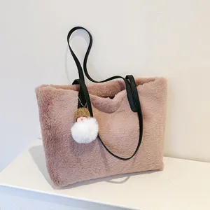 Stylish faux fur tote bag for women, soft plush shoulder bag with leather straps and cute pendant.