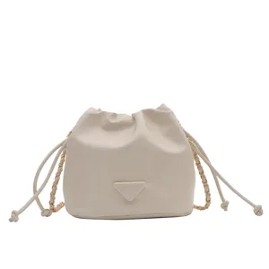 Chic off-white bucket bag with chain strap and drawstring closure for women daily fashion style.