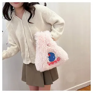 Cute cartoon monster plush shoulder bag for women, soft fluffy pink handbag with funny eye design.