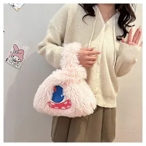Close-up view of the cute pink plush monster handbag featuring soft fabric and unique eye design.