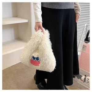 Cute cartoon monster plush handbag, soft furry shoulder bag detail view for daily wear.
