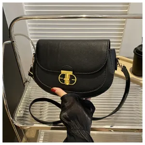 Black saddle crossbody bag for women, stylish leather shoulder bag with metal lock.