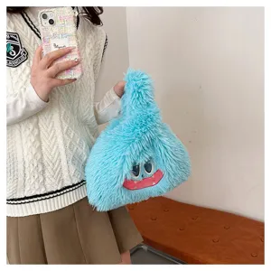 Detailed close-up of fluffy blue monster handbag, featuring soft plush material and cute design.