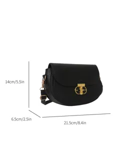 Detailed view of black women leather saddle bag showcasing gold lock hardware and dimensions.