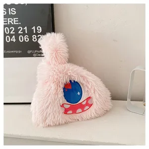 Cute little monster plush shoulder bag for women, soft furry handbag with funny cartoon eye design.