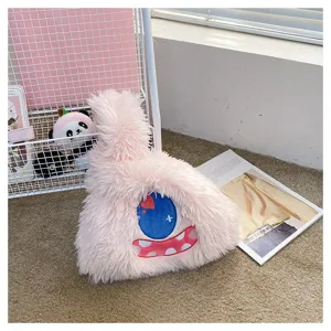 Cute monster plush handbag for women, soft furry shoulder bag with unique cartoon eye design.