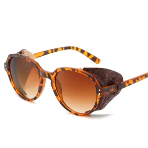 Lunettes de soleil steampunk rétro rondes avec protections en cuir et monture écaille.