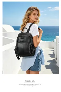 Detail view of a stylish black leather backpack outdoors by the sea, showcasing fine texture.