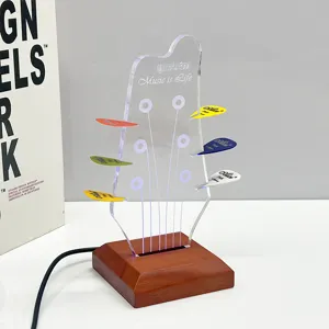 Acrylic guitar pick display stand featuring wooden LED luminous base and colorful picks.