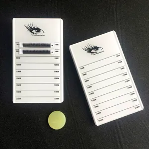 Acrylic eyelash extension pallet with length scale markings and jade glue holder tool detail.