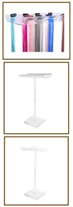 Clear acrylic wig display stand for hair extensions salon and retail shop desktop organization.