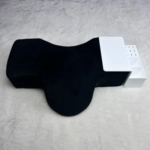 Eyelash extension neck pillow with white acrylic organizer shelf for professional salon use.