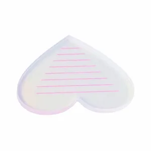 Heart-shaped laser eyelash extension palette with scale lines for professional lash artists.