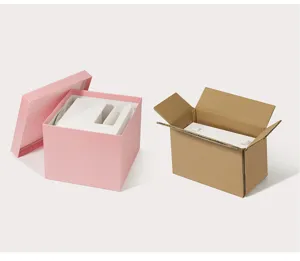 Detail view of eyelash tool packaging box, featuring a pink gift box and brown shipping box.