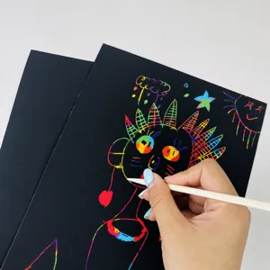 Scratch art paper for kids, DIY black magic scratchboards with bamboo pens for creative drawing.