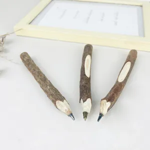 Rustic wooden twig ballpoint pens with natural bark texture for creative office gifts and decor.