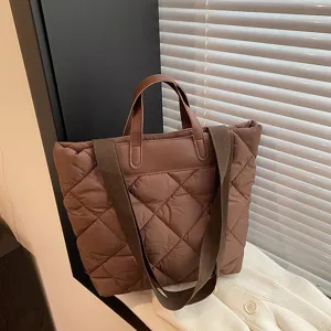 Brown quilted tote bag for women, large capacity casual shoulder bag with soft padded design.