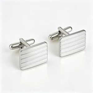 Detailed view of silver rectangular striped cufflinks for men's formal French shirts.