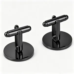 Closeup of glossy black polished stainless steel round cufflinks detail view for men shirts.