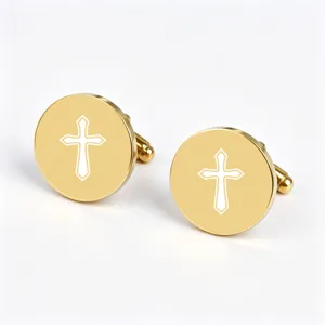 Detailed close-up shot of gold stainless steel round cufflinks with laser etched cross design.