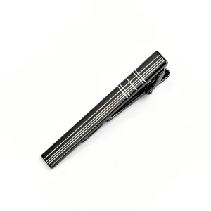 Close up detail of black metal tie clip with white grid pattern for men business style.