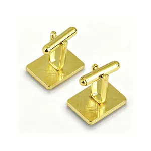 Gold-tone checkered square cufflinks detail, elegant metallic texture for men's formal shirts.