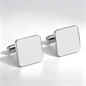Close-up detail shot of shiny mirror-polished square stainless steel French shirt cufflinks.